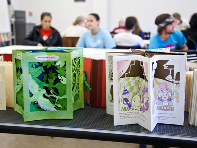 My little handmade book from October 2 above looks pretty lame compared to these constructed by Narae Kim.