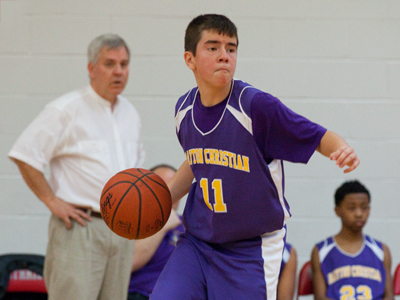 His coach watches from the bench, amazed at his talent.
