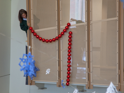 Seconds later, she nearly dropped this string of giant ornaments onto unsuspecting students on the first floor.