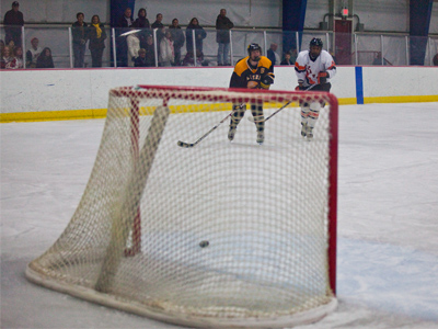 Behind by one with two minutes to go, the coach subbed the goalie to gain another offensive player, but that only led to two empty net goals and a lopsided final score.