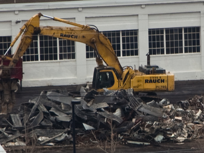 This demolition job is on the fast track;  there are desks in the debris.  I just hope all the employees got out in time.