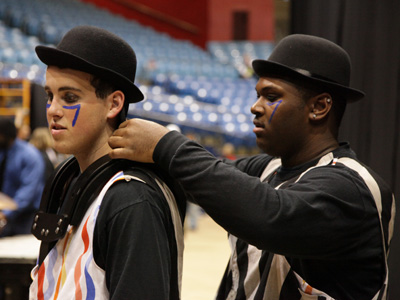 Costume adjustment backstage.