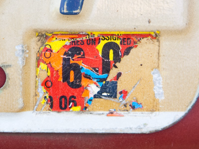 Surely this license plate sticker didn`t just fall off.