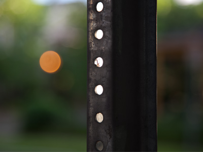 For an instant, this signpost captured a bit of sunset.  I made a camera adjustment, looked up, and it was gone.