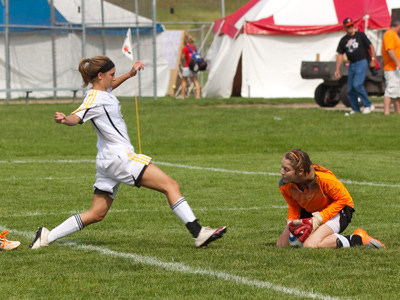 The keeper prevented a goal, but paid the price since there was no way the running player could stop in time.