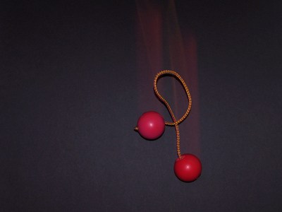 Using second curtain flash, these rubber balls look normal as they fall.