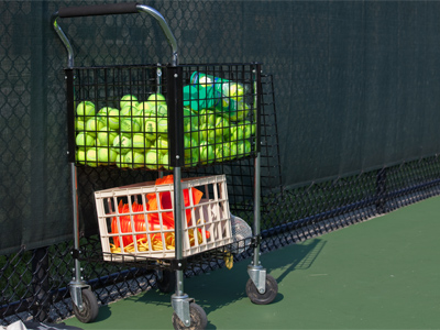 Today I saw buckets and baskets and boxes of tennis balls, more than I ever thought could exist in one place.