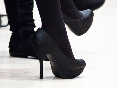 So I reluctantly put away my camera, but not before taking a picture of the shoes worn by someone sitting to my left.