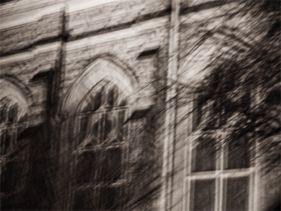 Photographed from a moving vehicle, this Lutheran church in downtown Dayton resembles a smudged pencil sketch.