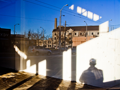 The whole genre of street photography would be far less interesting without empty storefronts and harsh shadows.