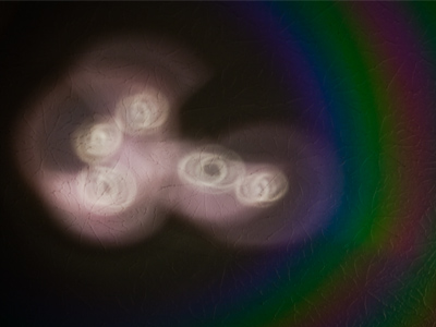 The reflection that five CDs make on the ceiling.