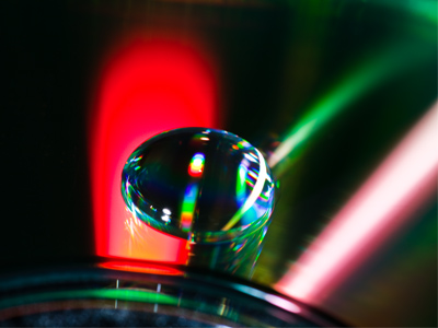 Water droplet on a defective CD (A.K.A. a `coaster`).