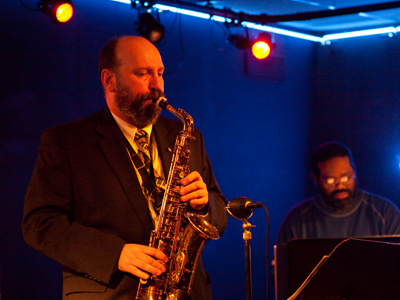 On stage at Jazz Central, Grant `King` Koeller plays saxophone with Kareem Powell at the keyboard.