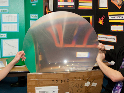 These guys used a giant lens to focus sunlight and start PENNIES on fire.  They blinded me . . . with science!!