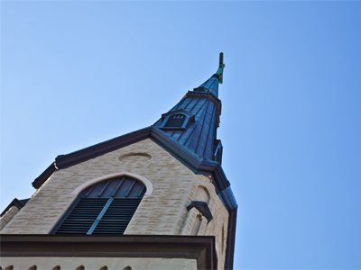 Directly above the bed of wild flowers.