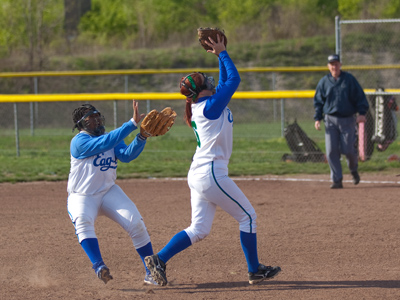 The fans cheer as the catch is made, but the coach yells.  `TALK TO EACH OTHER OUT THERE!`