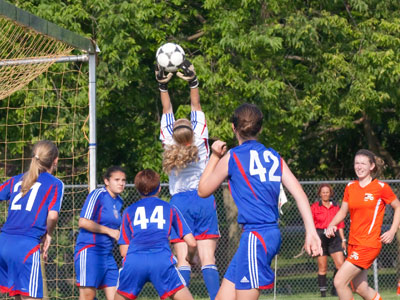 She had made an even better save moments earlier, but there weren`t a bunch of colorful uniforms in that photo.