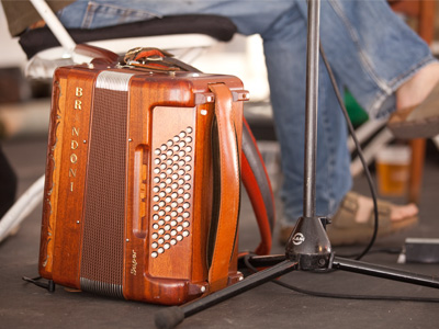 Handcrafted mahogany but, sadly, it`s still an accordion.