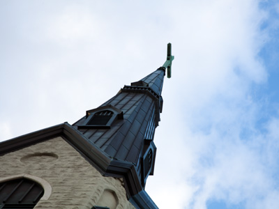 On the sidewalk below is a century`s worth of green stains from the copper steeple.