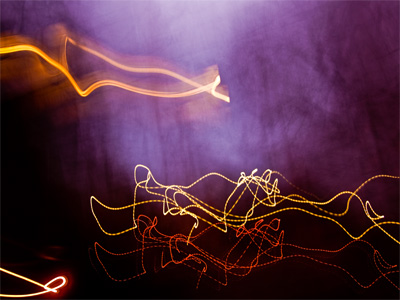 Walking through a dark alley, feeling cold and uncreative.