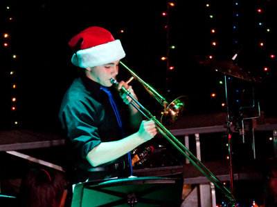 Santa plays the slide trombone.