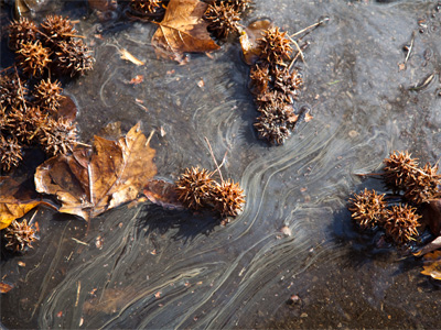 The snow and ice are melting into a toxic-looking sludge.