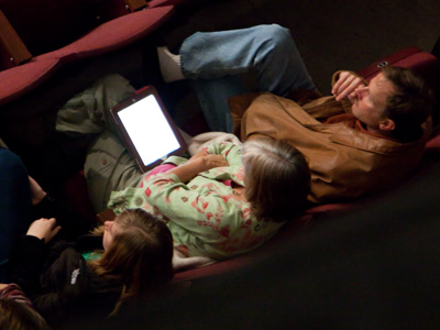 From my perch high above the auditorium, I can see who is paying attention to the concert and who isn`t.