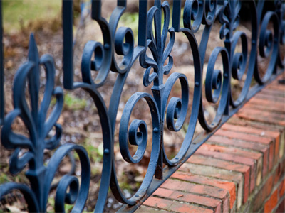 An iron fence, shot at an angle, becomes -- wait, some lady is coming out of the house.  She told me to `come back in the spring.`  I think she meant it in a nice way.