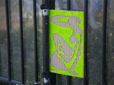 Cardboard art found along the sidewalk.