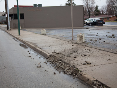 Today this curb sacrificed itself to save my life.  A black sports car hit it at high speed . . . 
