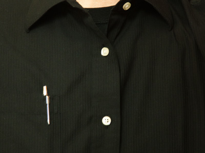 I used to work with a man who could wear an orange suit to the office and get away with it.  For me, it`s basic black.