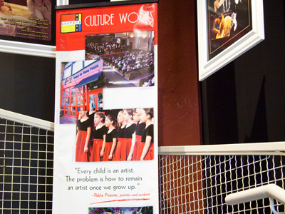 On the way to the memorial, I discovered two of my photos on this banner (with my name displayed properly nearby).