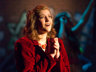 The background lights were just coming on for a scene change.  Any brighter and the mood would be broken.