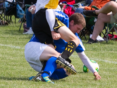  . . . but girls don`t tackle each other like guys frequently do.  The referee called `Blue hold` and the blue fans got mad.