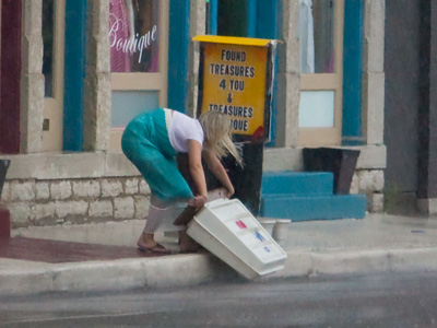 She felt obliged to run into a downpour and rescue a sign.  I felt obliged to stay in where it was dry and take pictures.