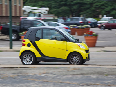 Once she gets to work, she puts the car under her desk.