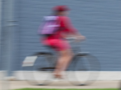 A somewhat stylishly dressed young woman with a bike and backpack begs for money in the Oregon District, holding a hand over her stomach to demonstrate her hunger.  No doubt she accepts all major credit cards.