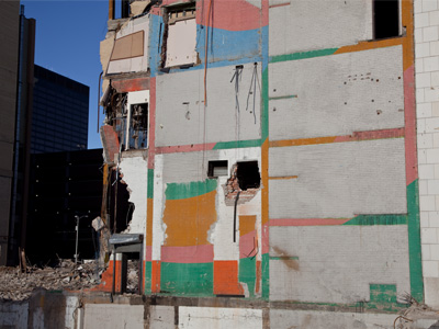 Colorful destruction.  There are still thumbtacks on the bulletin board in the upper left corner.