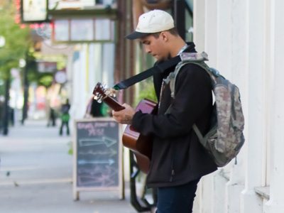 Some of the people who stand on the sidewalk playing music might be better off staying home to practice.