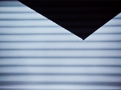 Me, flat on my back on the living room floor, shooting through the window at the overhanging roof.