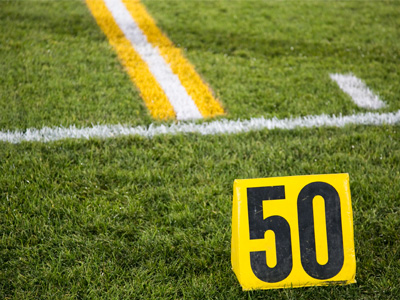 I was smart enough to wear boots, knowing that the field is natural grass with poor drainage -- and it`s been raining.