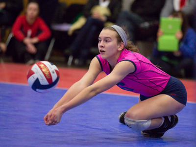 Volleyball terminology: this is a LIBERO making a DIG.