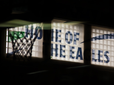 On a Sunday afternoon, the high school gym is silent . . . 