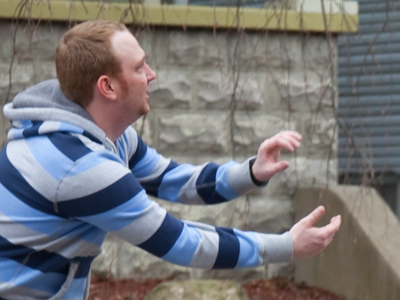 If it`s spring, why are people passing football in the street?