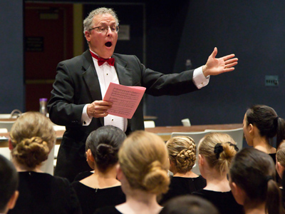 Warming up the singers before the concert.