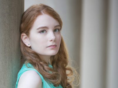 Most redheads have brown eyes.  Blue eyes are very rare.