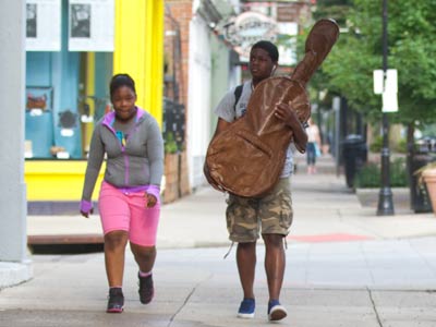 He took up cello since it was easier to carry than piano.