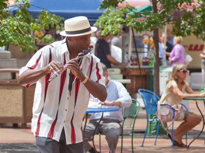 Most people work during the day.  He plays.