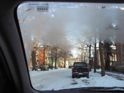 Patiently waiting for the ice INSIDE my windshield to melt.