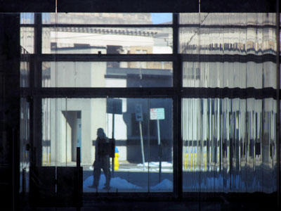 Yet another solitary figure walking through a city scene (see January 5, 7, 12 and 14 above, and December 30, 2014).  Some day I`m going to get punched.
